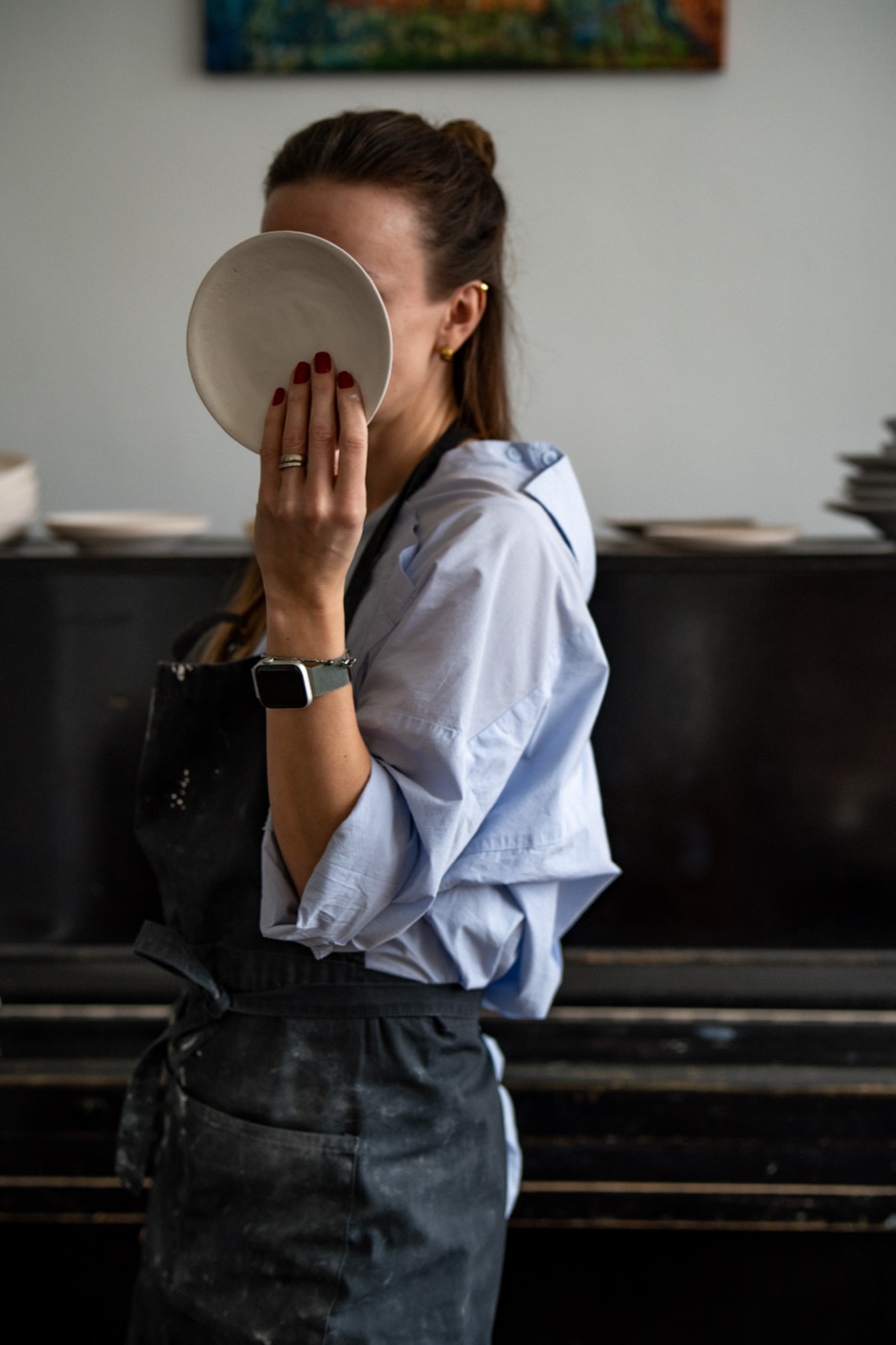 Agnes BR holding a ceramic plate