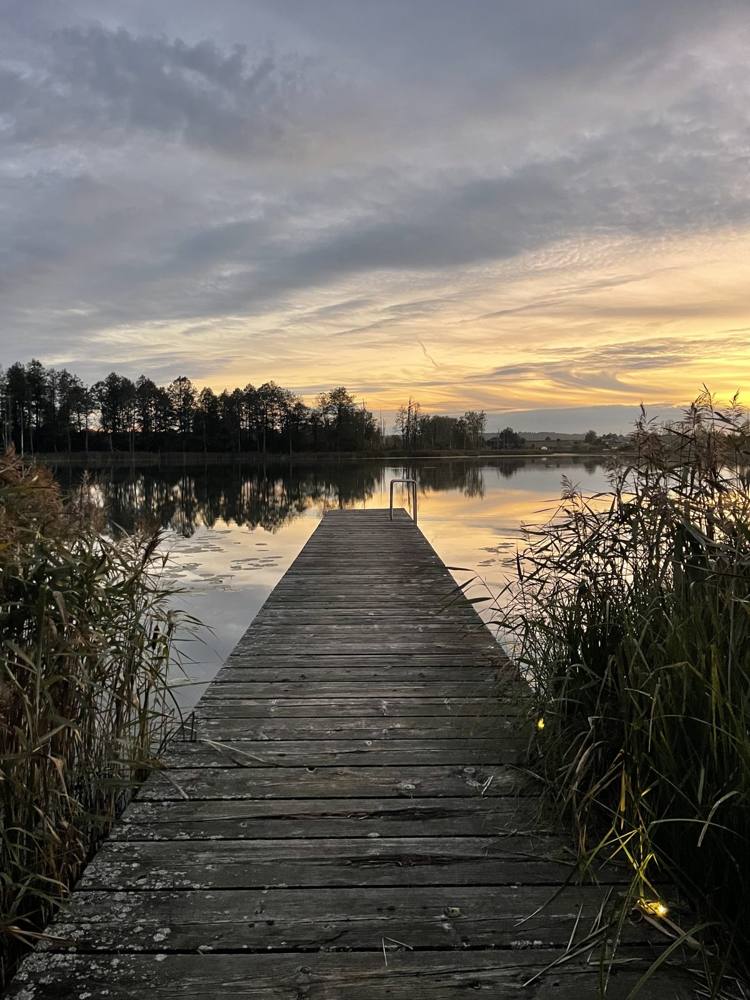 Wooden jetty on the lake at sunset, DOYOU PLACE, Lithuania