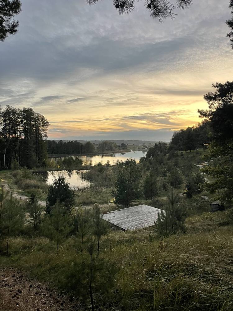 Sunset over the lake and forest near DOYOU PLACE, Lithuania