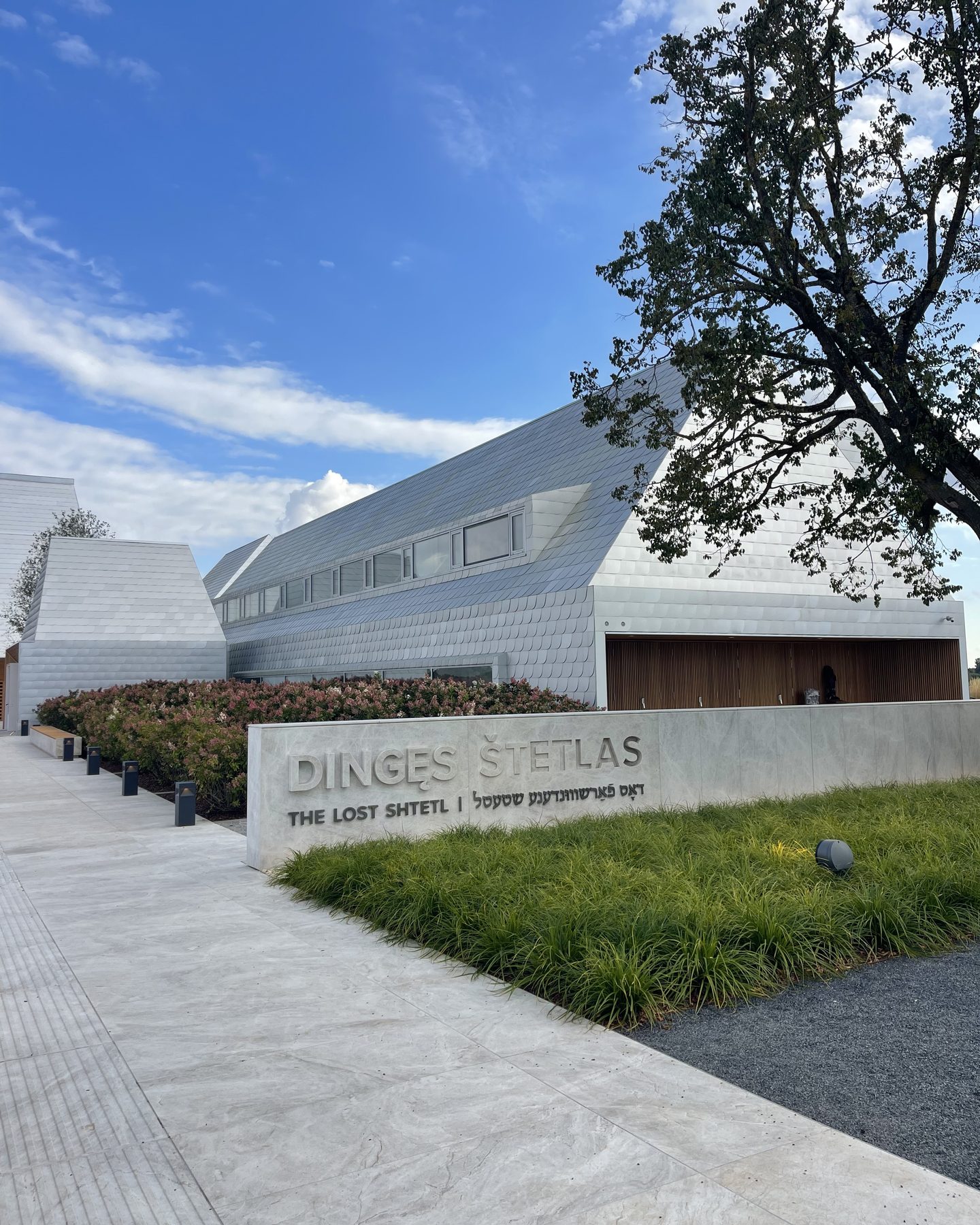 The white shingled buildings of the Lost Shtetl Museum in Šeduva